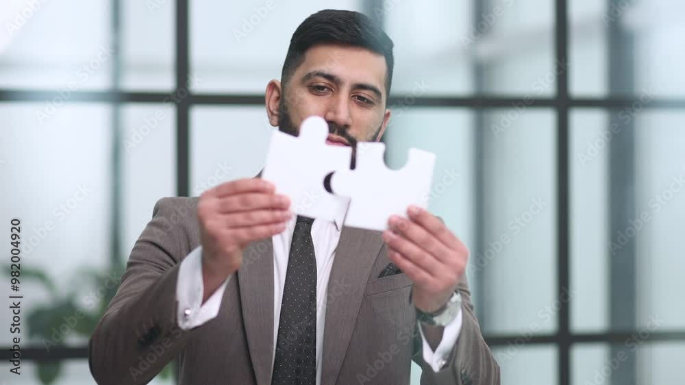 businessman show white jigsaw in hand, business strategy concept businessman show white jigsaw in hand, business strategy concept