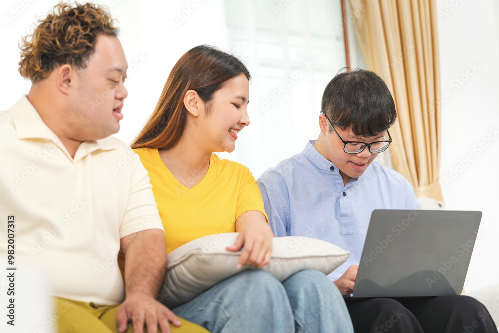 A group of friends using laptop doing a video call in living room, Man and woman sitting on sofa and using a laptop A group of friends using laptop doing a video call in living room, Man and woman sitting on sofa and using a laptop