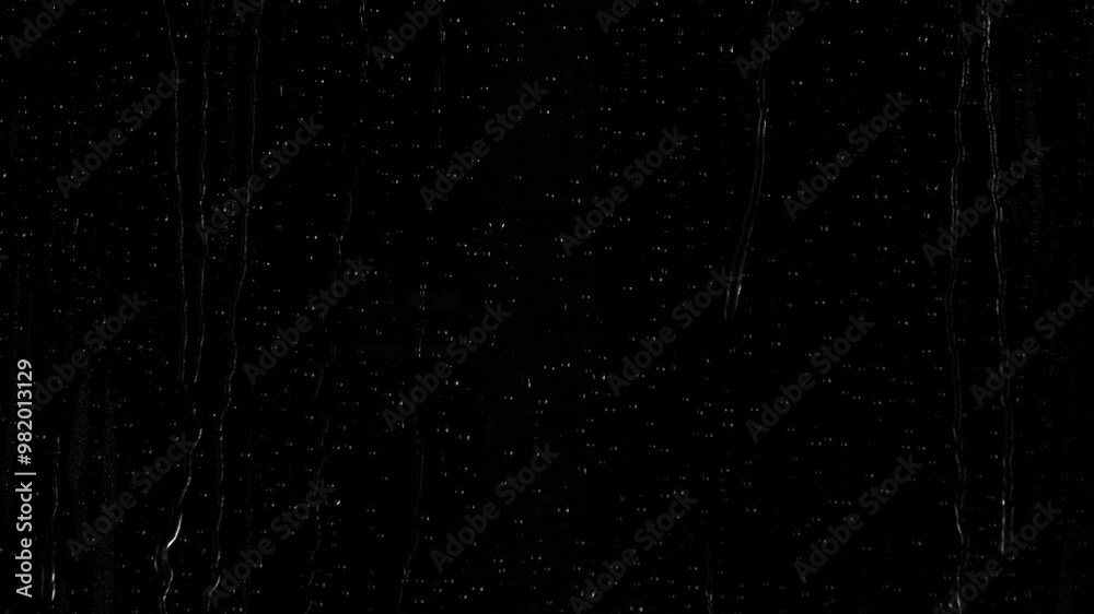 Closeup water rainfall, rain drops falling on window glass over black background