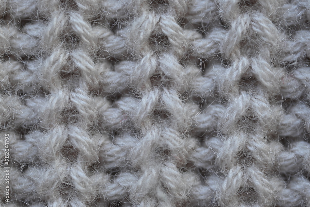 macro texture of woolen pastel crocheted sweater as background, close-up of brown crocheted front surface, woolen texture of woolen wool, trend pastel crocheted front surface macro texture of woolen pastel crocheted sweater as background, close-up of brown crocheted front surface, woolen texture of woolen wool, trend pastel crocheted front surface