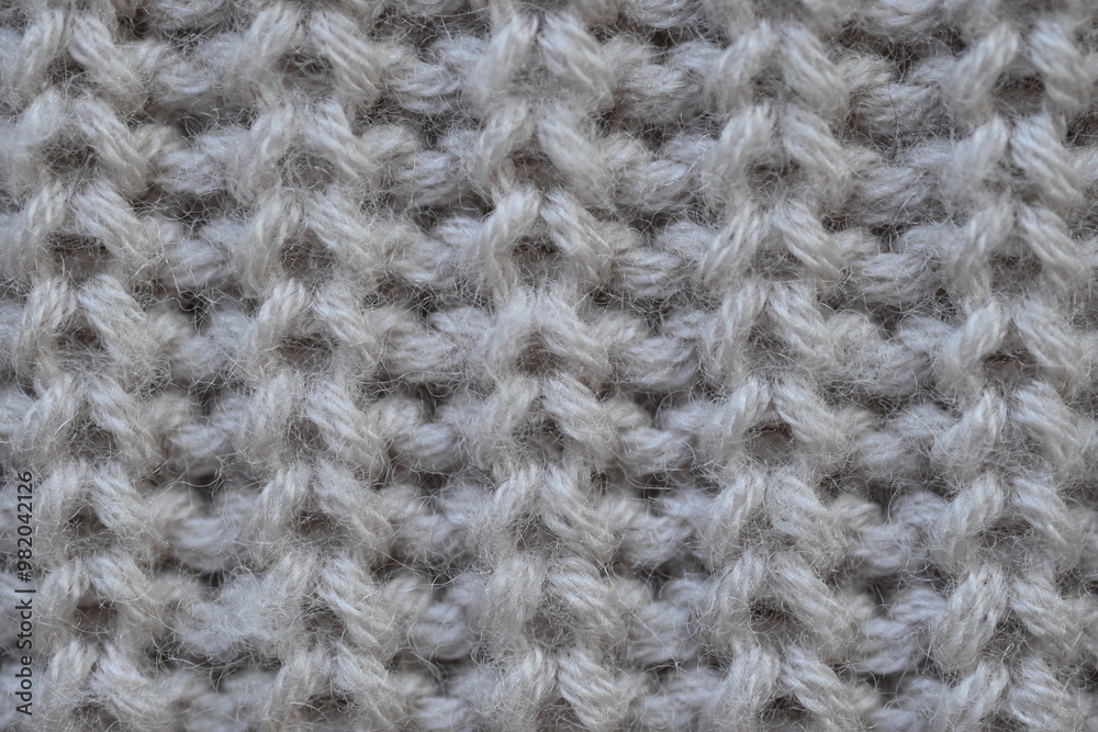 macro texture of woolen pastel crocheted sweater as background, close-up of brown crocheted front surface, woolen texture of woolen wool, trend pastel crocheted front surface macro texture of woolen pastel crocheted sweater as background, close-up of brown crocheted front surface, woolen texture of woolen wool, trend pastel crocheted front surface