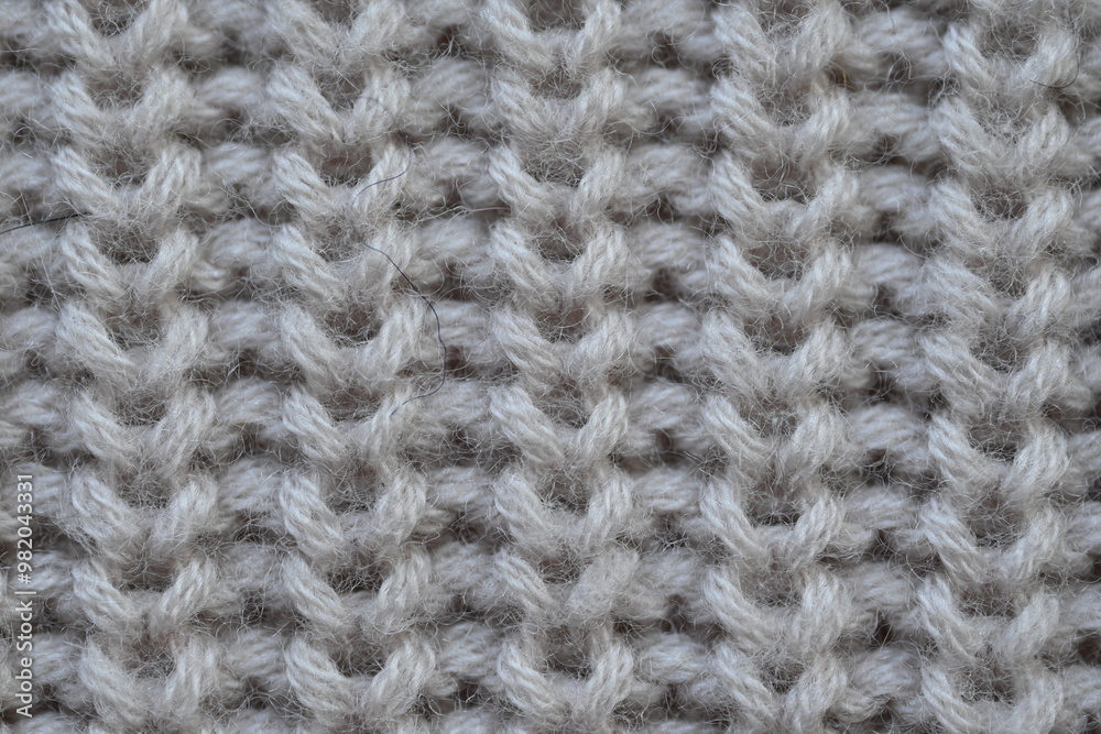 macro texture of woolen pastel crocheted sweater as background, close-up of brown crocheted front surface, woolen texture of woolen wool, trend pastel crocheted front surface macro texture of woolen pastel crocheted sweater as background, close-up of brown crocheted front surface, woolen texture of woolen wool, trend pastel crocheted front surface