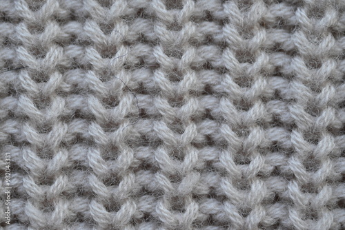 macro texture of woolen pastel crocheted sweater as background, close-up of brown crocheted front surface, woolen texture of woolen wool, trend pastel crocheted front surface photo