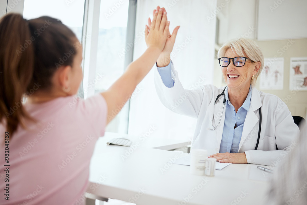 Fototapeta premium Woman, doctor and high five with girl at office for consultation, checkup and good news. People, pediatrician and patient with smile or happiness at clinic for healthcare, support and care or trust