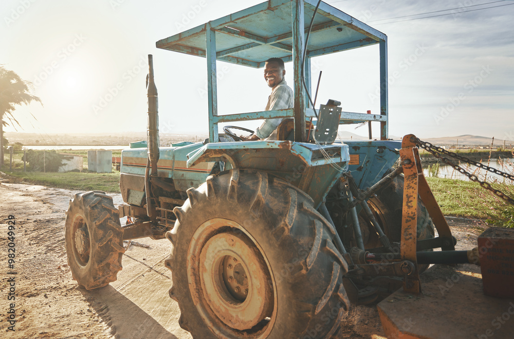 Farm, tractor and portrait with black man for quality inspection, sustainability and growth. Smile, agriculture and plant with person in Kenya countryside for food security, ecology and environment