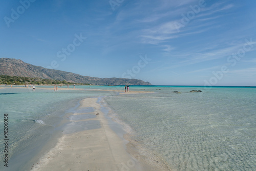 Fototapeta Naklejka Na Ścianę i Meble -  Water on the beach with people at Elafonissi Beach, Crete, Greece