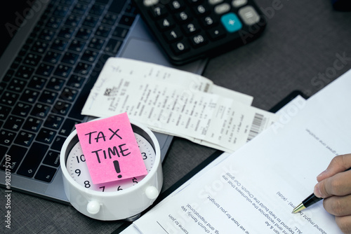'Tax time' memo on 1040 individual tax form. Need help and taxes text on stickers with tax forms. Assistance with filing tax form and calculation.