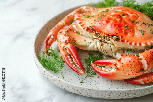 Grilled king crab garnished with fresh herbs on a minimalist plate for an elegant dining experience