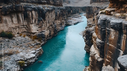 A Turquoise River Winding Through a Canyon of Rugged Cliffs