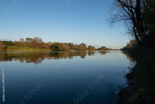 Obraz na płótnie Ticino river panorama banks water trees vision light evening natural naruralistic w salonie
