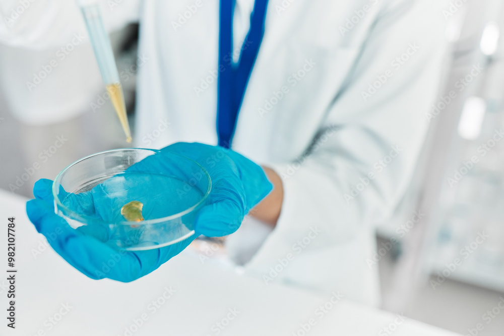 Dropper, hands or scientist with petri dish for samples particles, clinical trial or chemical discovery. Person, medical science or vaccine research in laboratory for closeup or mpox cure development Dropper, hands or scientist with petri dish for samples particles, clinical trial or chemical discovery. Person, medical science or vaccine research in laboratory for closeup or mpox cure development