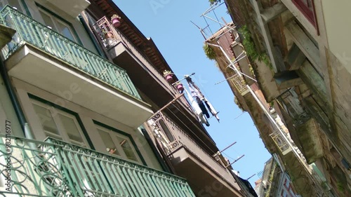 Some laundry and some balconies by a narrow street in Porto, Portugal.