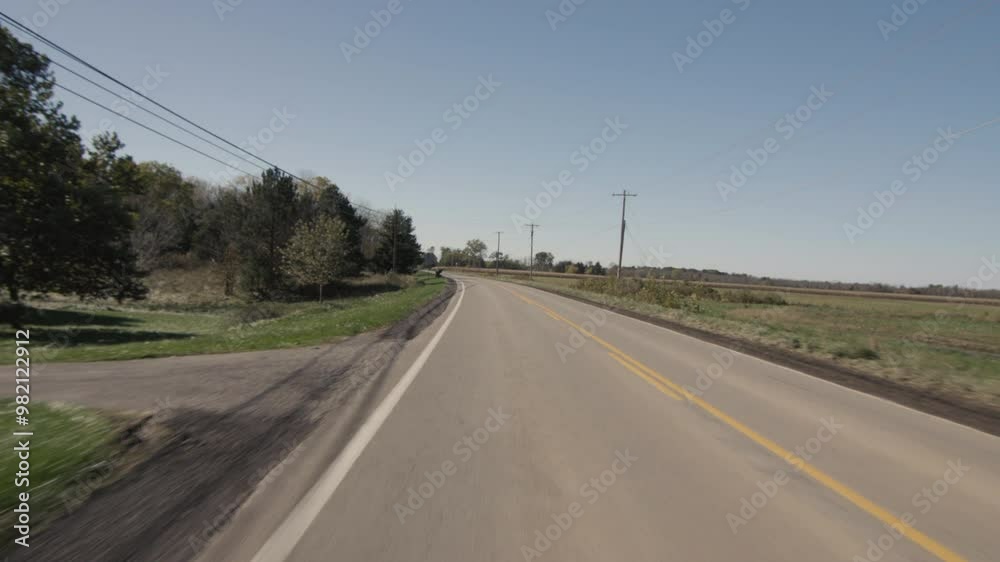 View from the driver to the road, driving through the countryside in the American outback View from the driver to the road, driving through the countryside in the American outback