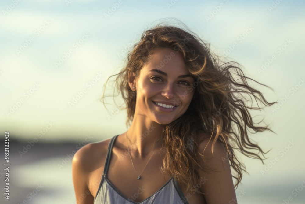 A woman with long hair is smiling and wearing a necklace A woman with long hair is smiling and wearing a necklace