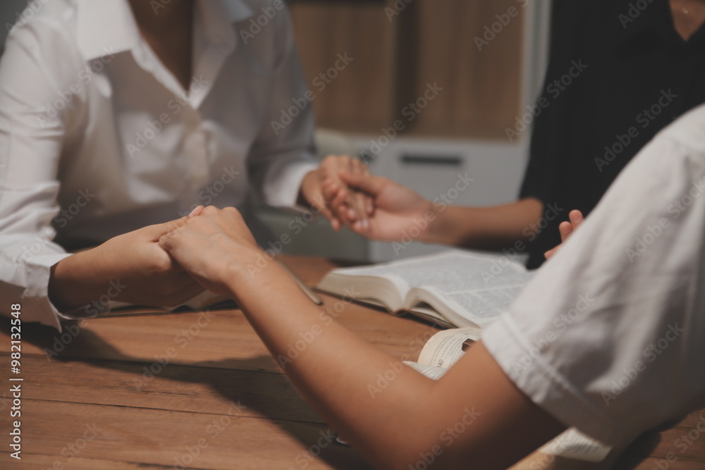 Fototapeta premium Christian group are praying to god with the bible and sharing the gospel. Concept of faith for god.