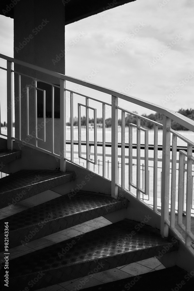 Fototapeta premium twisted metal stairs in harsh light