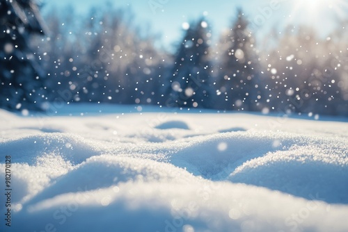 A beautiful winter background with snow and snowflakes falling from the sky.