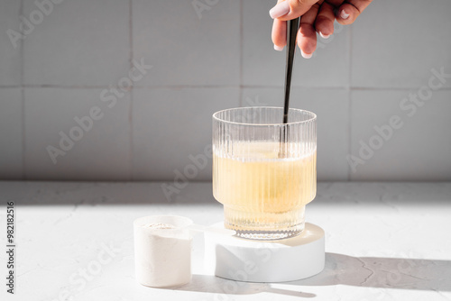 Принти на полотні Collagen protein powder in a scoop