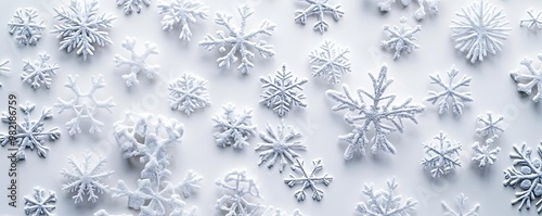 A beautiful array of intricate snowflakes on a white background, showcasing the delicate patterns and textures of winter.