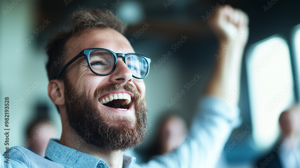 Obraz premium Happy colleagues playing a game and cheering in a modern office, team bonding and celebration, fun and positive energy, copy space