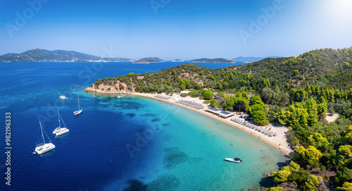 Fototapeta Naklejka Na Ścianę i Meble -  Panoramic aerial view of the pristine beach and turquoise sea at Tsougrias island, Skiathos, Sporades, Greece