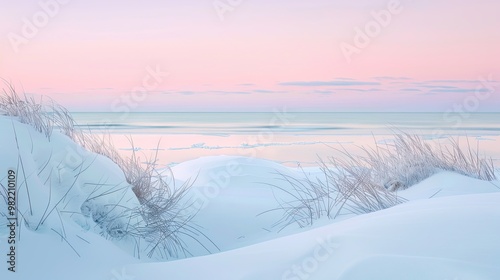 Snowy beach with frosty sea grass and icy ocean reflecting pale sunset ideal for text