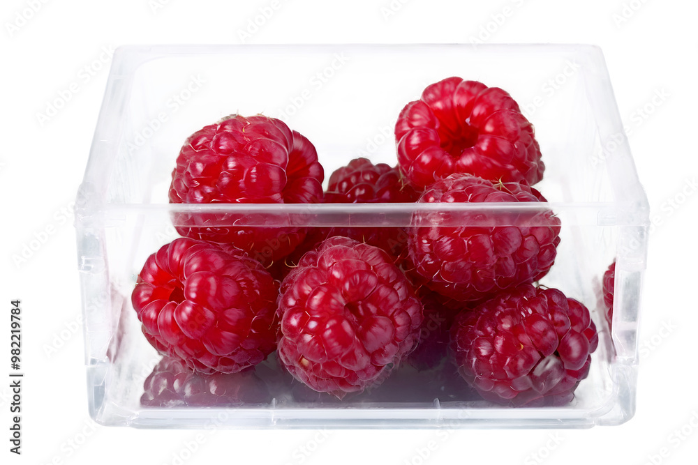Closeup of organic Raspberries in plastic packaging box, super foods, healthy fruit isolated on transparent background