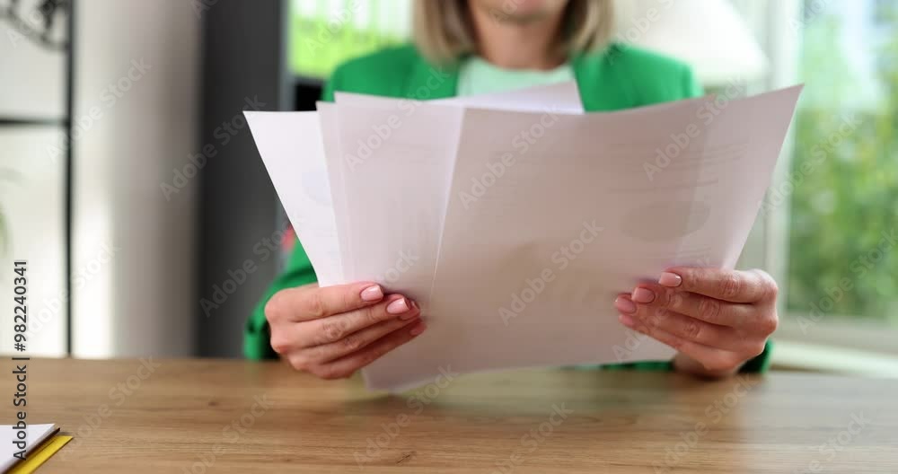 Business woman analyzing project statistics and report. Marketing analyst working with graphic documents Business woman analyzing project statistics and report. Marketing analyst working with graphic documents