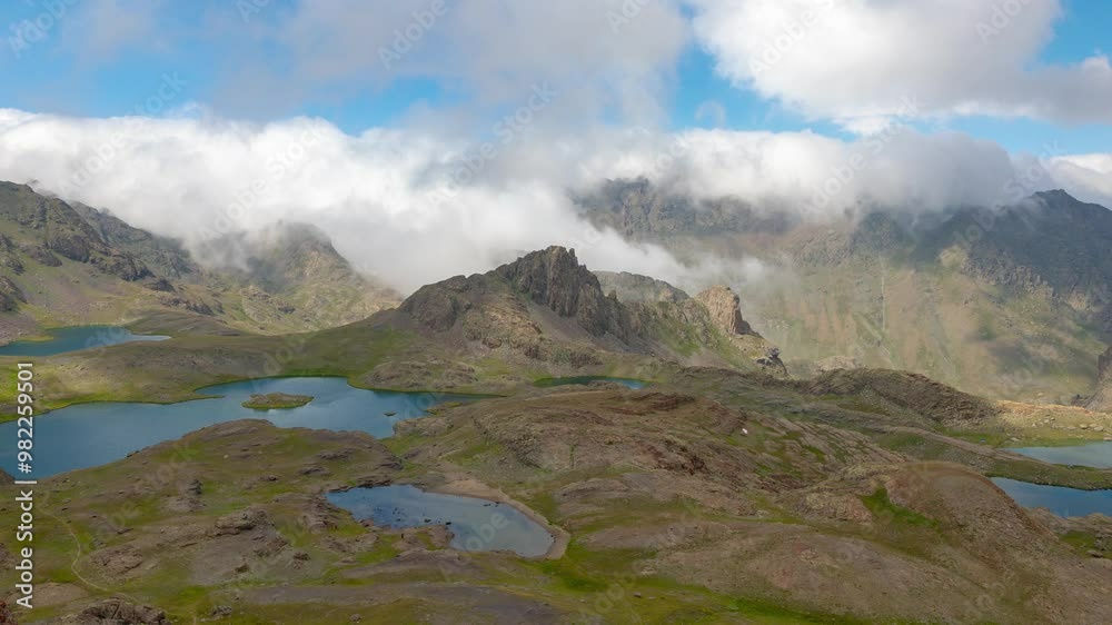 Glacier lakes on the top of the mountains and motion of the clouds in timelapse 4k video. Ispir Yedigoller in Erzurum province of Turkey.