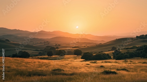 Beautiful Sunset Over Rolling Hills and Green Fields Landscape Photograph - Tranquil Countryside Scenery at Dusk