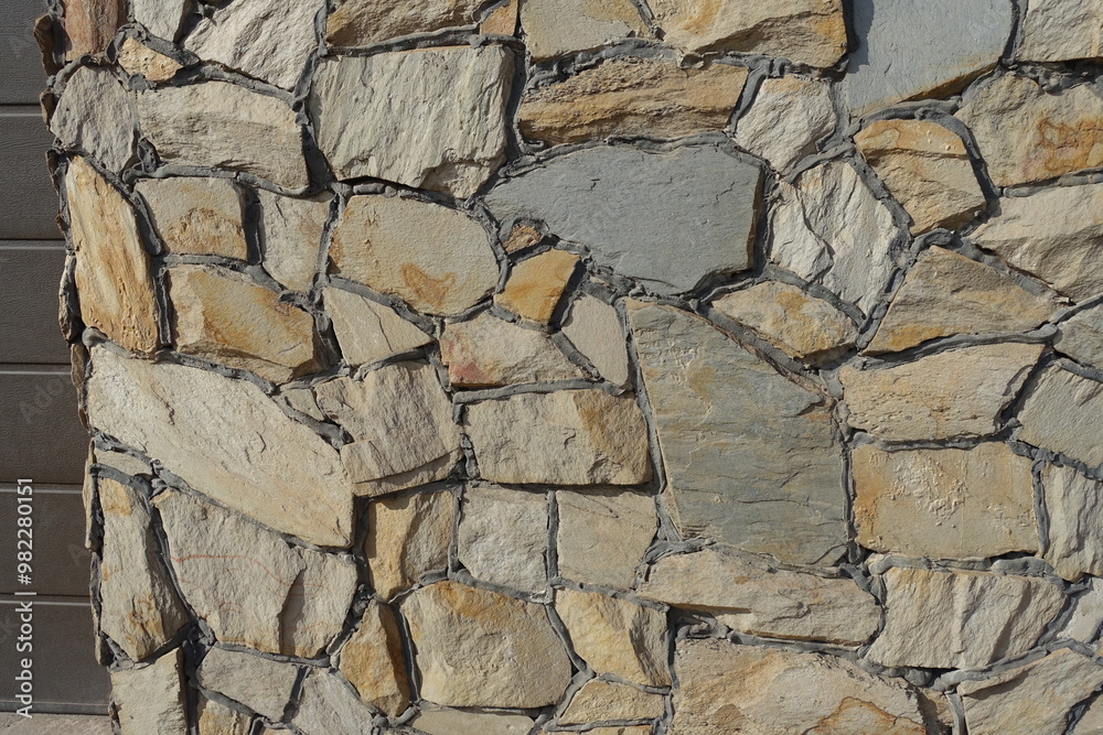 Fototapeta premium wall made of beige natural shape field stones