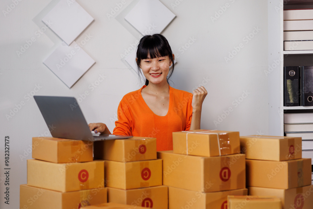 Successful woman start up online seller at workplace. small business entrepreneur SME or freelance asian woman working with box at home.
Successful woman start up online seller at workplace. small business entrepreneur SME or freelance asian woman working with box at home.
