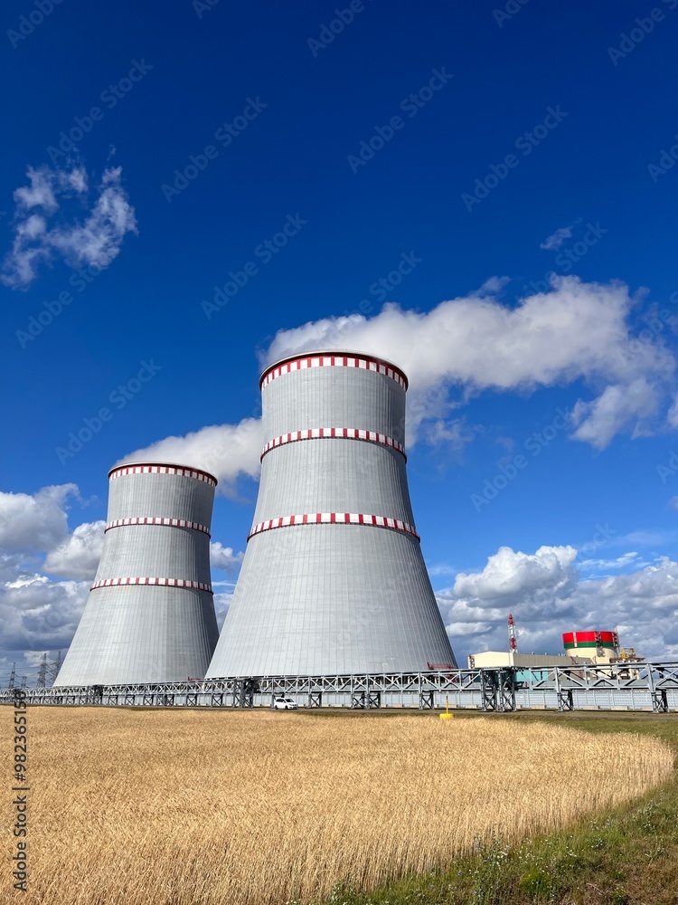 cooling towers of a nuclear power plant on a sunny day against a blue sky cooling towers of a nuclear power plant on a sunny day against a blue sky