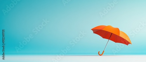 Red umbrella positioned slightly to the side on a smooth, light blue background.