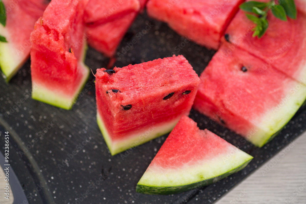 pieces of ripe red watermelon, close-up, on a board pieces of ripe red watermelon, close-up, on a board