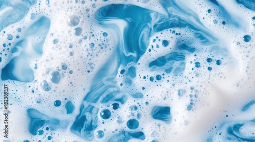 Foamy blue soap bubbles creating an intricate texture, filled with detailed foam and froth, representing cleanliness, freshness, and the refreshing sensation of soapy water