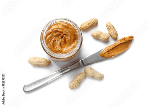 Tasty peanut butter and nuts isolated on white, top view photo