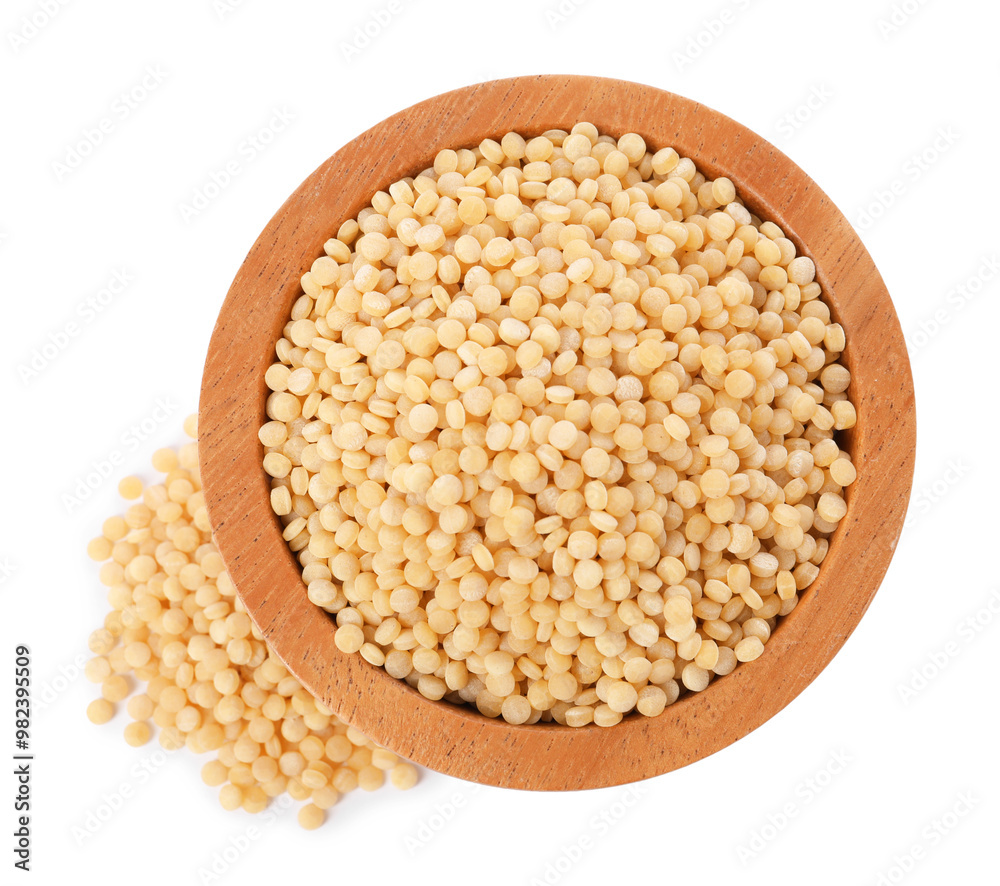 Raw couscous in wooden bowl isolated on white, top view Raw couscous in wooden bowl isolated on white, top view