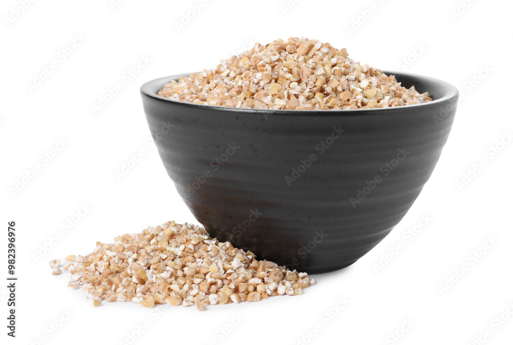 Dry wheat groats in bowl isolated on white Dry wheat groats in bowl isolated on white