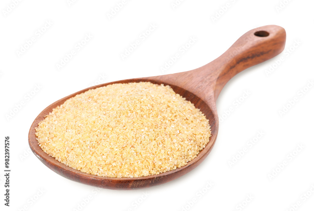 Spoon with raw wheat groats isolated on white Spoon with raw wheat groats isolated on white