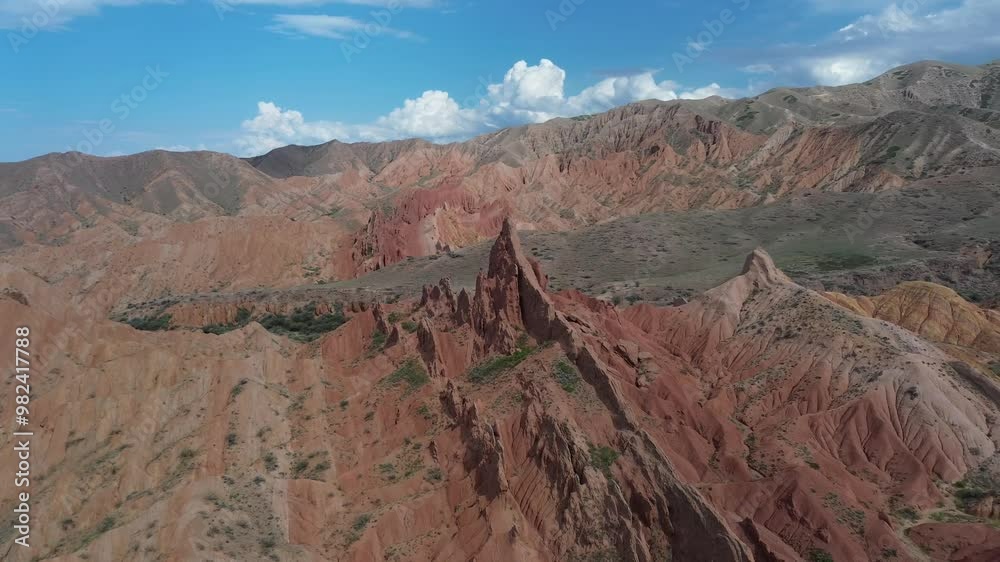The vibrant red rock formations in fairytale canyon under a bright blue sky, aerial view The vibrant red rock formations in fairytale canyon under a bright blue sky, aerial view