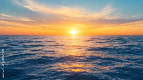 The sun rising gently over a peaceful ocean, creating a scene of calm and renewal, representing the concept of new beginnings and fresh opportunities with the morning light 