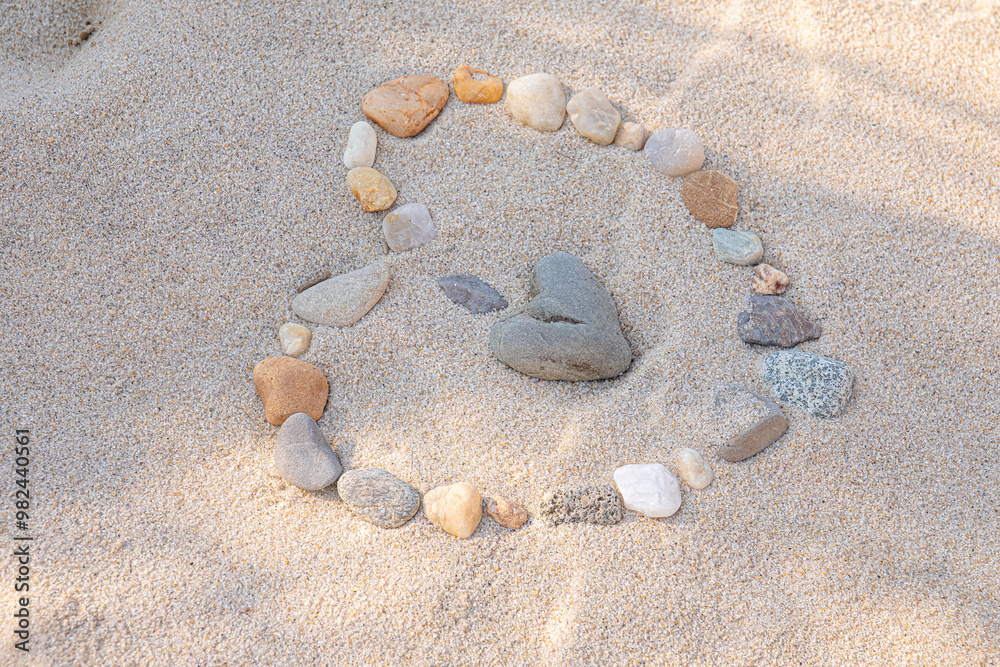 Rocks shaped to make Heart in beach sand Rocks shaped to make Heart in beach sand