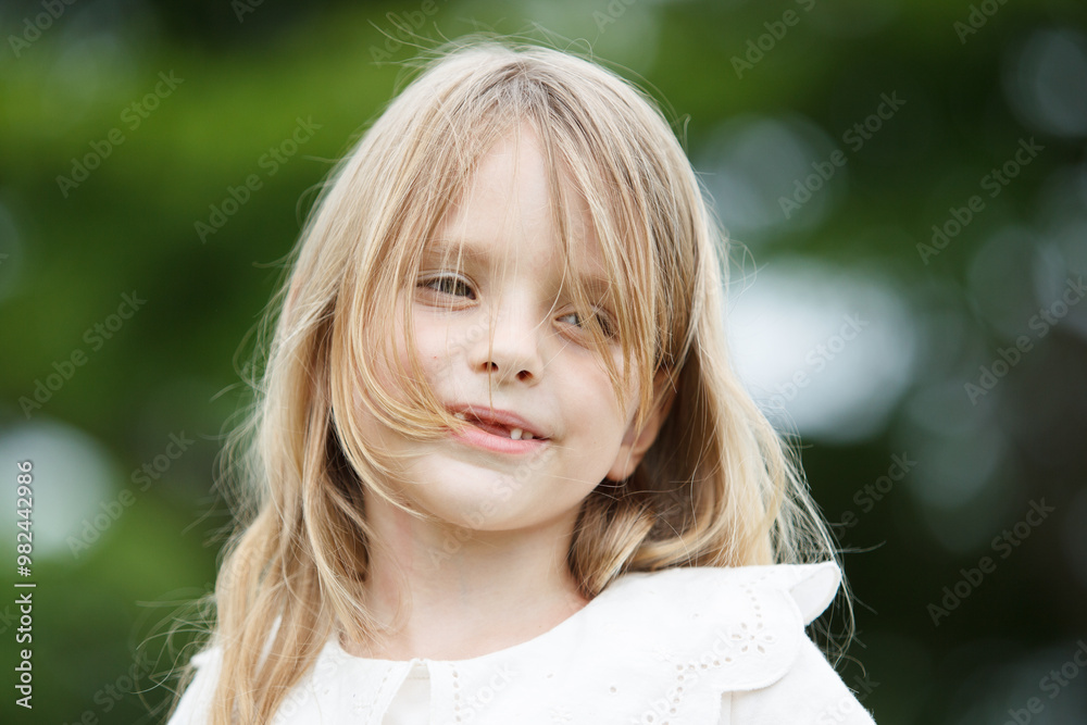 Portrait of caucasian lovely girl close up in nature blurred bokeh.