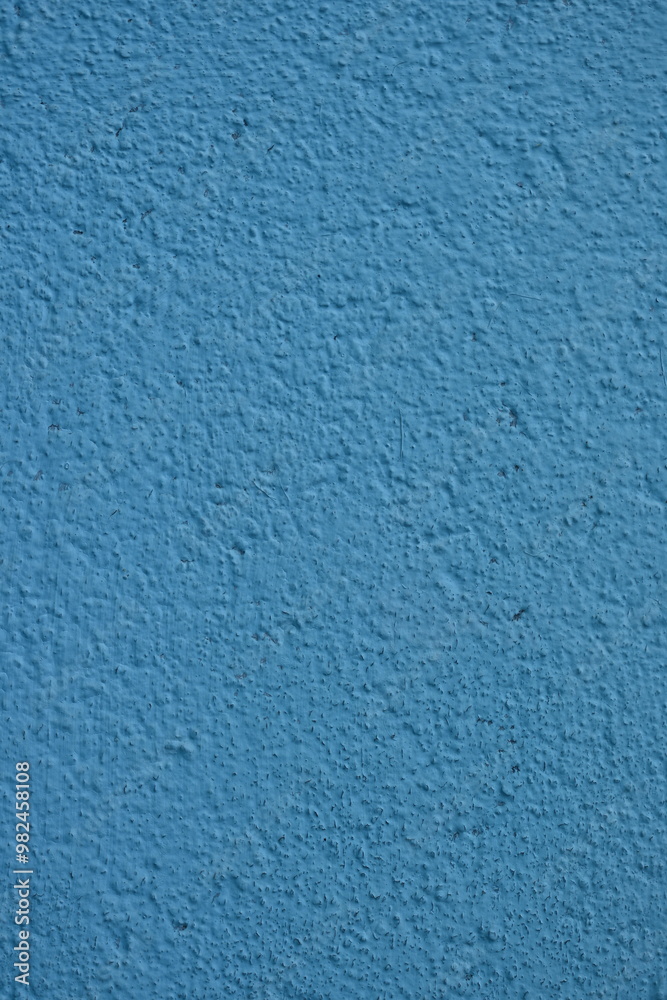 Obraz premium chipped old blue paint on the corner of the house, deterioration, old surface of the house 