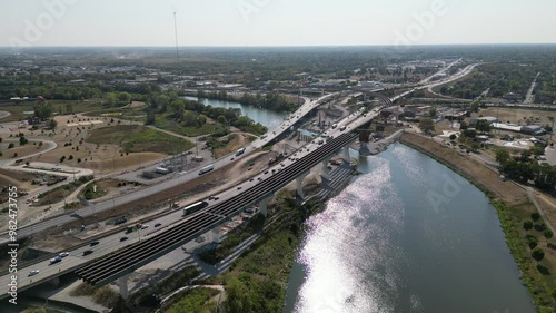 4K Drone footage of Columbus Ohio highway construction with traffic over a cinematic river on a afternoon sunny summer day