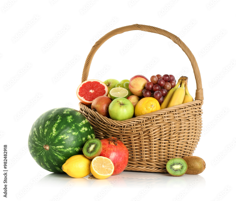 Many different fresh fruits in wicker basket isolated on white Many different fresh fruits in wicker basket isolated on white