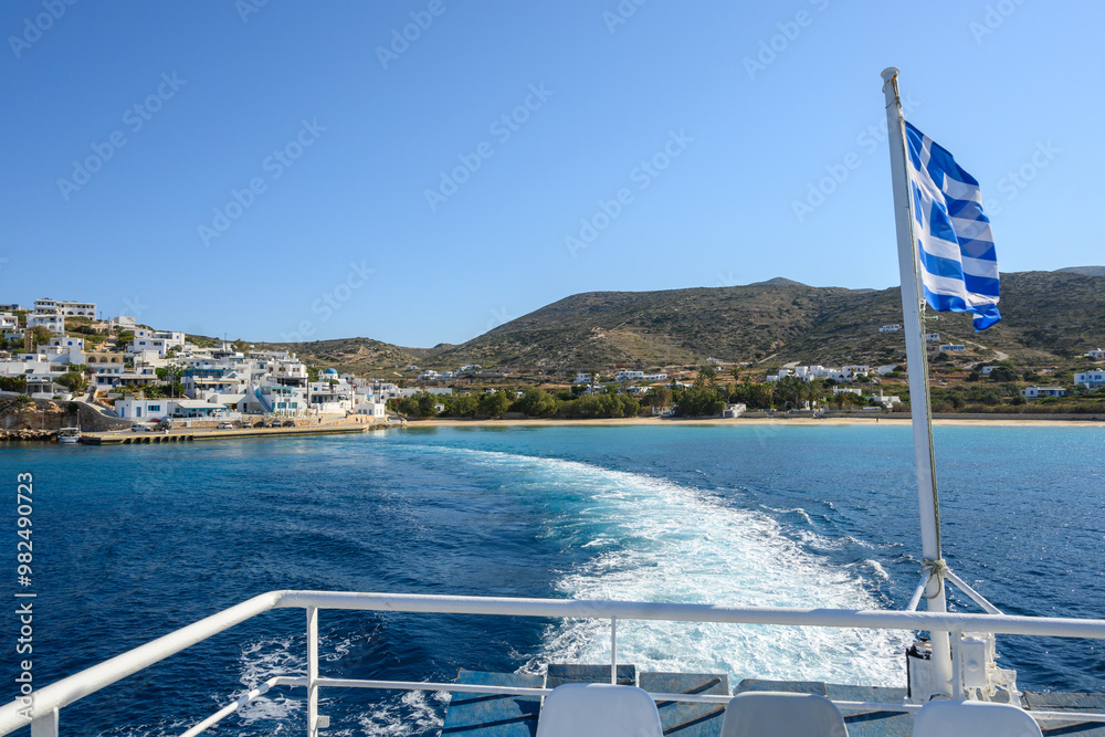 Deck of ferry with Greek flag leaving Donousa island. Cyclades, Greece