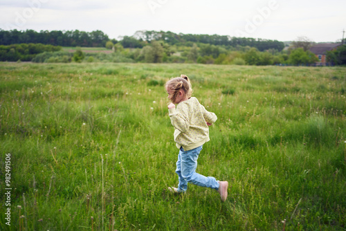 girls play catch up in a field