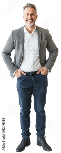 Confident businessman standing with hands in pockets